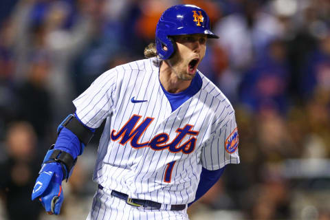 NEW YORK, NEW YORK – OCTOBER 08: Jeff McNeil #1 of the New York Mets hits a two run double during the seventh inning against the San Diego Padres in game two of the Wild Card Series at Citi Field on October 08, 2022 in New York City. (Photo by Elsa/Getty Images)