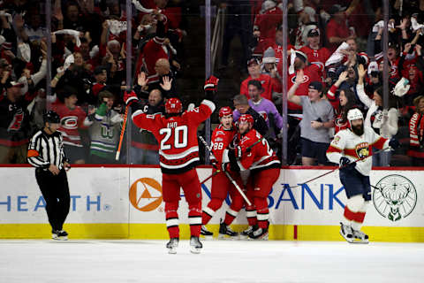 RALEIGH, NORTH CAROLINA – MAY 18: Stefan Noesen #23 of the Carolina Hurricanes celebrates with teammates Martin Necas #88 and Sebastian Aho #20 after scoring a goal on Sergei Bobrovsky #72 of the Florida Panthers during the third period in Game One of the Eastern Conference Final of the 2023 Stanley Cup Playoffs at PNC Arena on May 18, 2023 in Raleigh, North Carolina. (Photo by Bruce Bennett/Getty Images)