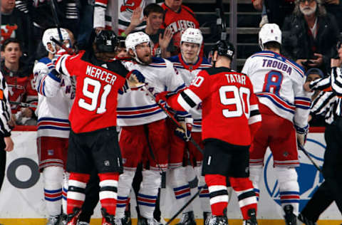 NEWARK, NEW JERSEY – APRIL 27: Ryan Lindgren #55 of the New York Rangers exchanges words with Tomas Tatar #90 of the New Jersey Devils during the first period in Game Five of the First Round of the 2023 Stanley Cup Playoffs at Prudential Center on April 27, 2023 in Newark, New Jersey. (Photo by Bruce Bennett/Getty Images)