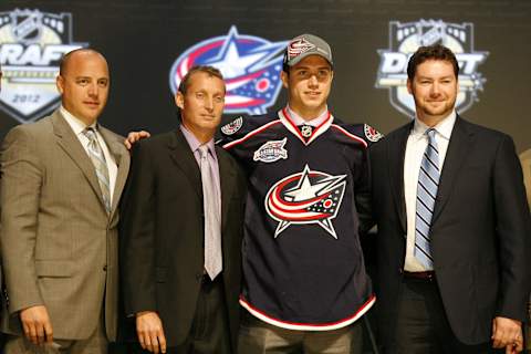 June 22, 2012; Pittsburgh, PA, USA; Ryan Murray is selected by the Columbus Blue Jackets in the 2012 NHL Draft at CONSOL Energy Center. Mandatory Credit: Charles LeClaire-USA TODAY Sports