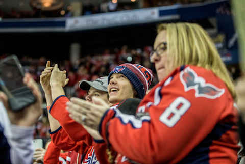 WASHINGTON, DC – DECEMBER 31: Washington Capitals fans celebrate a score during a NHL game between the Washington Capitals and the Nashville Predators on December 31, 2018, at Capital One Arena, in Washington D.C.(Photo by Tony Quinn/Icon Sportswire via Getty Images)