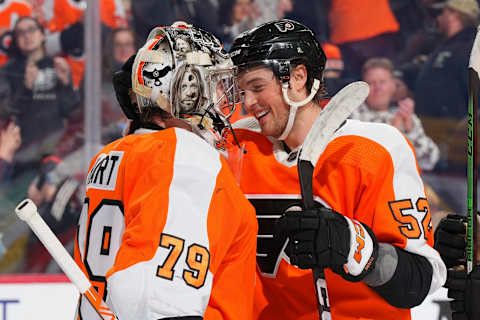 Tyson Foerster and Carter Hart celebrate a Flyers win. (Photo by Mitchell Leff/Getty Images)