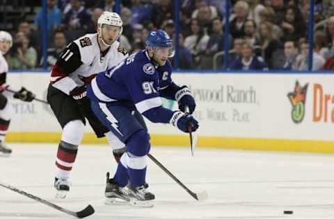 Feb 23, 2016; Tampa, FL, USA; Tampa Bay Lightning center Steven Stamkos (91) passes the puck as Arizona Coyotes center Martin Hanzal (11) defends during the first period at Amalie Arena. Mandatory Credit: Kim Klement-USA TODAY Sports