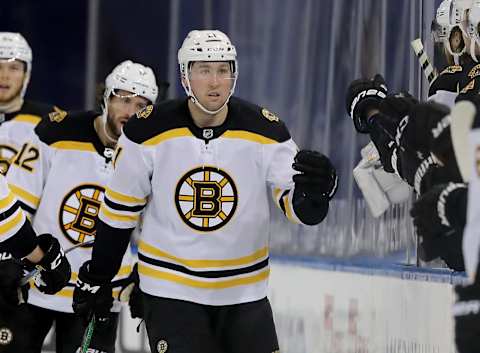 NEW YORK, NEW YORK – FEBRUARY 12: Nick Ritchie #21 of the Boston Bruins celebrates his goal with teammates on the bench in the second period against the New York Rangers at Madison Square Garden on February 12, 2021, in New York City. Due to COVID-19 restrictions, games are played without fans in attendance. (Photo by Elsa/Getty Images)