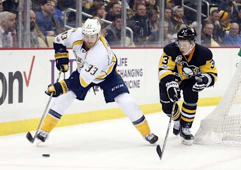 Jan 31, 2017; Pittsburgh, PA, USA; Nashville Predators left wing Colin Wilson (33) skates after the puck against pressure from Pittsburgh Penguins defenseman Olli Maatta (3) during the first period at the PPG PAINTS Arena. Mandatory Credit: Charles LeClaire-USA TODAY Sports