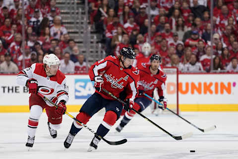 WASHINGTON, DC – APRIL 20: Nicklas Backstrom #19 of the Washington Capitals and Aleksi Saarela #15 of the Carolina Hurricanes skate after the puck in the first period in Game Five of the Eastern Conference First Round during the 2019 NHL Stanley Cup Playoffs at Capital One Arena on April 20, 2019 in Washington, DC. (Photo by Patrick McDermott/NHLI via Getty Images)