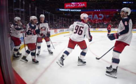 WASHINGTON, DC – FEBRUARY 08: Trey Fix-Wolansky #64 of the Columbus Blue Jackets celebrates with teammates after scoring a goal during the third period of his NHL debut against the Washington Capitals at Capital One Arena on February 8, 2022 in Washington, DC. (Photo by Scott Taetsch/Getty Images)