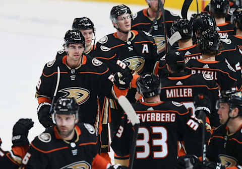 ANAHEIM, CA – JANUARY 29: Anaheim Ducks center Derek Grant (38) on the ice with his teammates after the Ducks defeated the Arizona Coyotes 4 to 2 in a game played on January 29, 2020, at the Honda Center in Anaheim, CA. (Photo by John Cordes/Icon Sportswire via Getty Images)