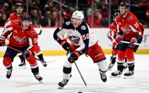 WASHINGTON, DC – OCTOBER 08: Eric Robinson #50 of the Columbus Blue Jackets handles the puck against the Washington Capitals during a preseason game at Capital One Arena on October 08, 2022 in Washington, DC. (Photo by G Fiume/Getty Images)