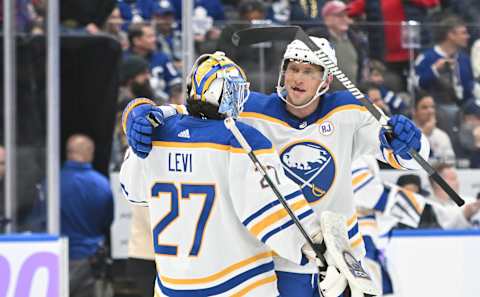 Nov 4, 2023; Toronto, Ontario, CAN; Buffalo Sabres goalie Devon Levi (27) and defenseman Erik Johnson (6) celebrate after a win over the Toronto Maple Leafs at Scotiabank Arena. Mandatory Credit: Dan Hamilton-USA TODAY Sports