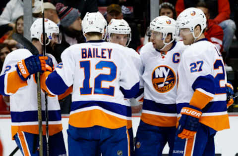 NHL Power Rankings: New York Islanders center John Tavares (second from right) receives congratulations from teammates after scoring in the second period against the Detroit Red Wings at Joe Louis Arena. Mandatory Credit: Rick Osentoski-USA TODAY Sports