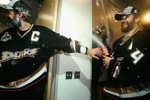 ANAHEIM, CA – JUNE 06: Rob Niedermayer #44 sprays his brother Scott Niedermayer #27 of the Anaheim Ducks (Photo by Jeff Gross/Getty Images)