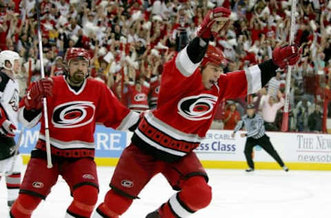 RALEIGH, NC – JUNE 01: Rod Brind’Amour #17 of the Carolina Hurricanes celebrates his game-winning goal in front of teammate Justin Williams #11 during the third period against the Buffalo Sabres in game seven of the Eastern Conference Finals in the 2006 NHL Playoffs on June 1, 2006 at RBC Arena in Raleigh, North Carolina. The Hurricanes won the game 4-2 and advance to the Stanley Cup Finals against the Edmonton Oilers. (Photo by Jim McIsaac/Getty Images)