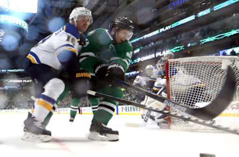 DALLAS, TEXAS – MAY 01: Jay Bouwmeester #19 of the St. Louis Blues and Esa Lindell #23 of the Dallas Stars skate for the puck during the first period of Game Four of the Western Conference Second Round of the 2019 NHL Stanley Cup Playoffs at American Airlines Center on May 1, 2019 in Dallas, Texas. (Photo by Ronald Martinez/Getty Images)