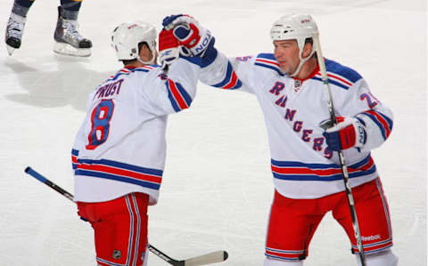 BUFFALO, NY – APRIL 06: Brandon Prust #8 and Anders Eriksson #25 of the New York Rangers celebrate Prust’s goal aginst the Buffalo Sabres in the first period at HSBC Arena on April 6, 2010 in Buffalo, New York. (Photo by Rick Stewart/Getty Images)