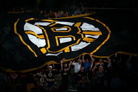 BOSTON, MA – JUNE 24: Boston Bruins fans hold a giant flag with the Boston Logo on it prior Game Six of the 2013 NHL Stanley Cup Final against the Chicago Blackhawks at TD Garden on June 24, 2013 in Boston, Massachusetts. (Photo by Elsa/Getty Images)