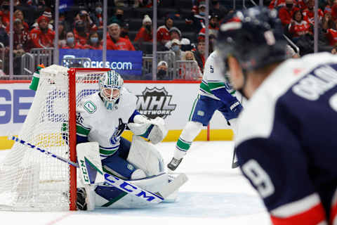 Jan 16, 2022; Washington, District of Columbia, USA; Vancouver Canucks goaltender Thatcher Demko (35) prepares to make a save on Washington Capitals defenseman Dmitry Orlov (9) during the third period at Capital One Arena. Mandatory Credit: Geoff Burke-USA TODAY Sports