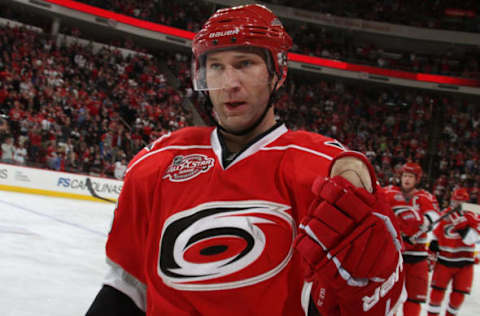 RALEIGH, NC – APRIL 06: Erik Cole #26 of the Carolina Hurricanes skates back to the bench after scoring a third period goal during an NHL game against the Detroit Red Wings on April 6, 2011 at RBC Center in Raleigh, North Carolina. (Photo by Gregg Forwerck/NHLI via Getty Images)