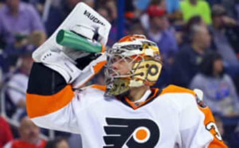 Mar 25, 2017; Columbus, OH, USA; Philadelphia Flyers goalie Michal Neuvirth (30) splashes his face with water during a stop in play in the second period at Nationwide Arena. Mandatory Credit: Aaron Doster-USA TODAY Sports