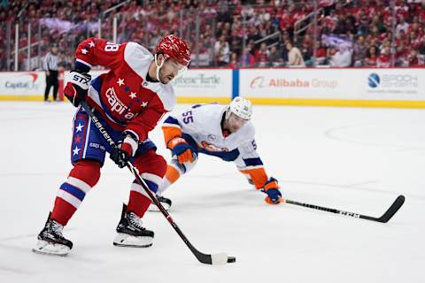 WASHINGTON, DC – APRIL 06: Chandler Stephenson #18 of the Washington Capitals skates with the puck against Johnny Boychuk #55 of the New York Islanders in the first period at Capital One Arena on April 6, 2019 in Washington, DC. (Photo by Patrick McDermott/NHLI via Getty Images)