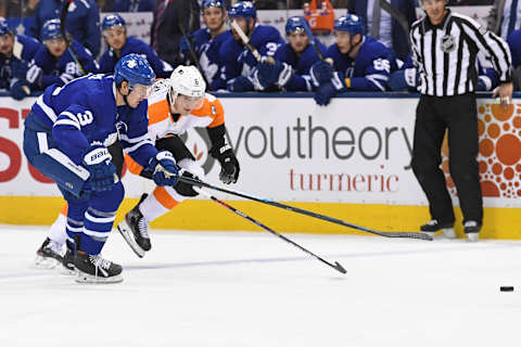 TORONTO, ON – NOVEMBER 09: Toronto Maple Leafs Defenceman Justin Holl (3) and Philadelphia Flyers Defenceman Travis Sanheim (6) race for the puck during the regular season NHL game between the Philadelphia Flyers and Toronto Maple Leafs on November 9, 2019 at Scotiabank Arena in Toronto, ON. (Photo by Gerry Angus/Icon Sportswire via Getty Images)