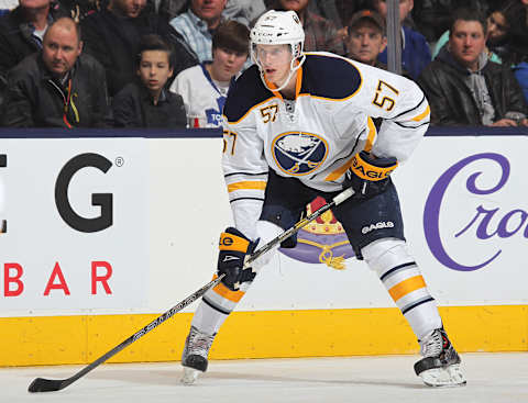 TORONTO, ON – DECEMBER 27: Tyler Myers #57 of the Buffalo Sabres waits for a faceoff against the Toronto Maple Leafs during an NHL game at the Air Canada Centre on December 27, 2013 in Toronto, Ontario, Canada. The Leafs defeated the Sabres 4-3 in an overtime shoot-out. (Photo by Claus Andersen/Getty Images)