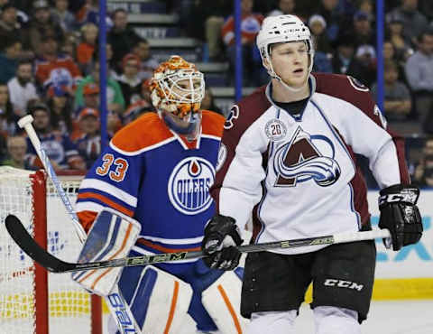 Feb 20, 2016; Edmonton, Alberta, CAN; Colorado Avalanche forward Nathan MacKinnon (29) tries to screen Edmonton Oilers goaltender Cam Talbot (33) during the second period at Rexall Place. Mandatory Credit: Perry Nelson-USA TODAY Sports