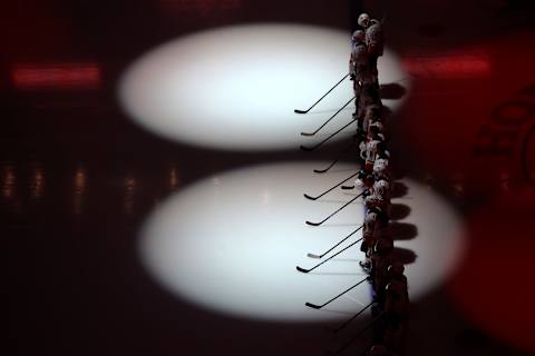 LOS ANGELES, CALIFORNIA – FEBRUARY 12: The Calgary Flames line up during the United States national anthem prior to a game against the Anaheim Ducks at Staples Center on February 12, 2020, in Los Angeles, California. (Photo by Sean M. Haffey/Getty Images)