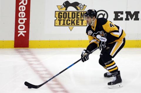 NHL Players: Pittsburgh Penguins defenseman Justin Schultz (4) carries the puck up ice against the Detroit Red Wings during the second period at the PPG PAINTS Arena. The Penguins won 5-3. Mandatory Credit: Charles LeClaire-USA TODAY Sports