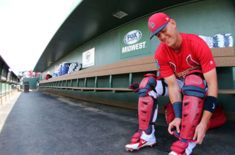 JUPITER, FL – MARCH 10: Carson Kelly #19 of the St. Louis Cardinals puts on his gear before a spring training game against the Miami Marlins at Roger Dean Stadium on March 10, 2018 in Jupiter, Florida. (Photo by Rich Schultz/Getty Images)