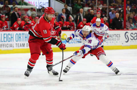 RALEIGH, NC – NOVEMBER 07: Carolina Hurricanes defenseman Dougie Hamilton (19) passes the puck while New York Rangers center Artemi Panarin (10) goes for it during the 2nd period of the Carolina Hurricanes game versus the New York Rangers on November 7th, 2019 at PNC Arena in Raleigh, NC (Photo by Jaylynn Nash/Icon Sportswire via Getty Images)