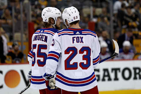 PITTSBURGH, PA – MAY 13: Ryan Lindgren #55 of the New York Rangers talks with Adam Fox #23 during a stoppage in play in Game Six of the First Round of the 2022 Stanley Cup Playoffs against the Pittsburgh Penguins at PPG PAINTS Arena on May 13, 2022, in Pittsburgh, Pennsylvania. (Photo by Kirk Irwin/Getty Images)