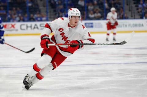 TAMPA, FL – SEPTEMBER 17: Carolina Hurricanes defenseman Haydn Fleury (4) skates during the NHL Preseason game between the Carolina Hurricanes and Tampa Bay Lightning on September 17, 2019 at Amalie Arena in Tampa, FL. (Photo by Mark LoMoglio/Icon Sportswire via Getty Images)