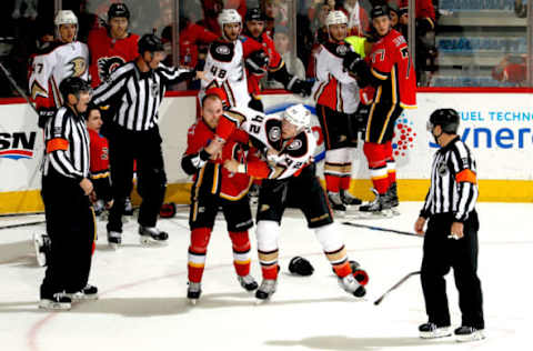 CALGARY, AB: Sam Bennett #93 of the Calgary Flames fights Josh Manson #42 of the Anaheim Ducks during an NHL game on January 6, 2018. (Photo by Brad Watson/NHLI via Getty Images)