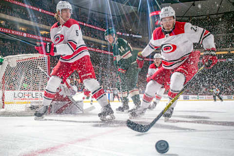 ST. PAUL, MN – MARCH 6: Brett Pesce #22 and Noah Hanifin #5 of the Carolina Hurricanes skate to the puck against the Minnesota Wild during the game at the Xcel Energy Center on March 6, 2018 in St. Paul, Minnesota. (Photo by Bruce Kluckhohn/NHLI via Getty Images)