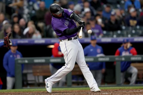 DENVER, COLORADO – APRIL 16: C.J. Cron #25 of the Colroado Rockies hits a 3 RBI home run against the Chicago Cubs in the third inning at Coors Field on April 16, 2022 in Denver, Colorado. (Photo by Matthew Stockman/Getty Images)