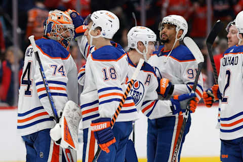 Nov 24, 2023; Washington, District of Columbia, USA; Edmonton Oilers goaltender Stuart Skinner (74) celebrates with Oilers left wing Zach Hyman (18) after their game against the Washington Capitals at Capital One Arena. Mandatory Credit: Geoff Burke-USA TODAY Sports