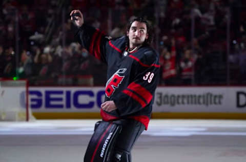 May 19, 2021; Raleigh, North Carolina, USA; Carolina Hurricanes goaltender Alex Nedeljkovic (39) celebrates his win against the Nashville Predators in game two of the first round of the 2021 Stanley Cup Playoffs at PNC Arena. Mandatory Credit: James Guillory-USA TODAY Sports