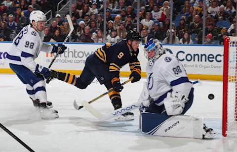 BUFFALO, NY – DECEMBER 31: Andrei Vasilevskiy #88 of the Tampa Bay Lightning makes a save against Jack Eichel #9 of the Buffalo Sabres as Mikhail Sergachev #98 defends during an NHL game on December 31, 2019 at KeyBank Center in Buffalo, New York. (Photo by Bill Wippert/NHLI via Getty Images)