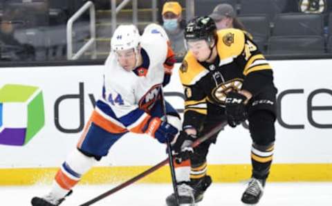 May 10, 2021; Boston, Massachusetts, USA; New York Islanders center Jean-Gabriel Pageau (44) battles with Boston Bruins defenseman Charlie McAvoy (73) during overtime at TD Garden. Mandatory Credit: Bob DeChiara-USA TODAY Sports