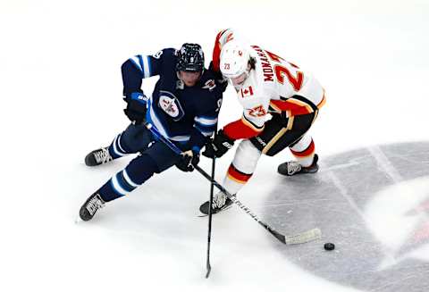 Winnipeg Jets, Andrew Copp #9, Calgary Flames, Sean Monahan #23 (Photo by Jeff Vinnick/Getty Images)