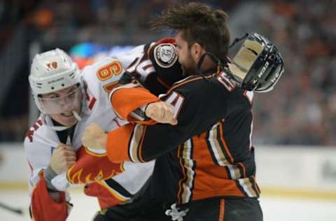 November 6, 2016; Anaheim, CA, USA; Anaheim Ducks left wing Joseph Cramarossa (74) fights against Calgary Flames left wing Matthew Tkachuk (19) during the second period at Honda Center. Mandatory Credit: Gary A. Vasquez-USA TODAY Sports