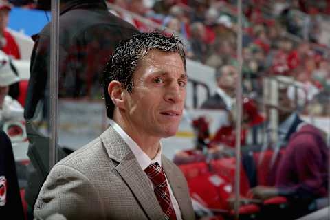 RALEIGH, NC – NOVEMBER 13: Rod Brind’Amour assitant coach of the Carolina Hurricanes watches action on the ice from the bench area during an NHL game against the Dallas Stars on November 13, 2017 at PNC Arena in Raleigh, North Carolina. (Photo by Gregg Forwerck/NHLI via Getty Images)