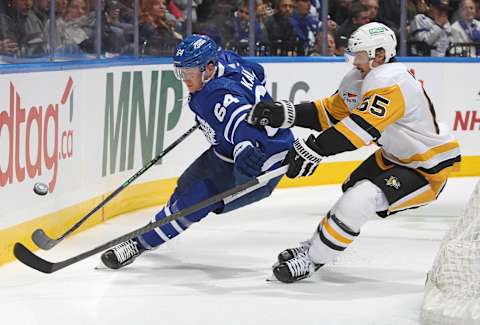 TORONTO, CANADA – DECEMBER 16: Erik Karlsson #65 of the Pittsburgh Penguins skates against David Kampf #64 of the Toronto Maple Leafs during the second period in an NHL game at Scotiabank Arena on December 16, 2023 in Toronto, Ontario, Canada. (Photo by Claus Andersen/Getty Images)