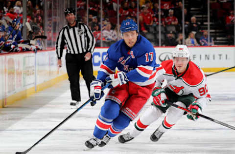 Jesper Fast #17 of the New York Rangers takes the puck