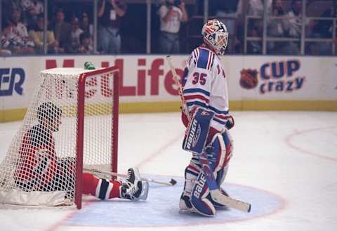 Right wing John Maclean sits inside the goal: (Al Bello /Allsport)