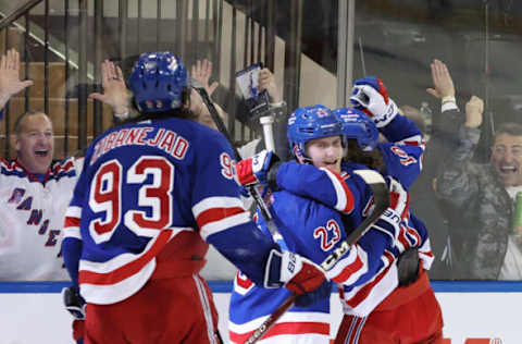 NEW YORK, NEW YORK – JANUARY 12: Mika Zibanejad #93 and Artemi Panarin #10 celebrate with Adam Fox #23 of the New York Rangers after Fox’s game-winning goal during overtime against the Dallas Stars at Madison Square Garden on January 12, 2023, in New York City. The Rangers won 2-1 in overtime. (Photo by Sarah Stier/Getty Images)