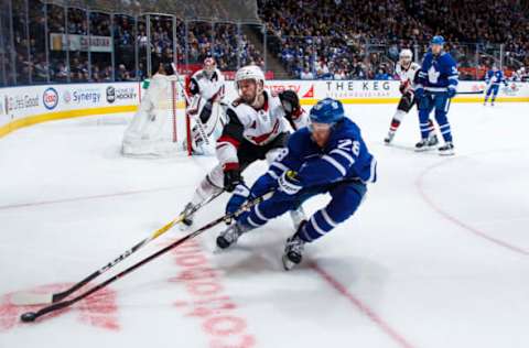 TORONTO, ON – JANUARY 20: Connor Brown #28 of the Toronto Maple Leafs battles with the puck with Niklas Hjalmarsson #4 of the Arizona Coyotes during the third period at the Scotiabank Arena on January 20, 2019 in Toronto, Ontario, Canada. (Photo by Mark Blinch/NHLI via Getty Images)