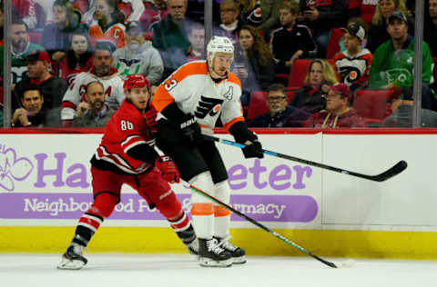 RALEIGH, NC – NOVEMBER 21: Teuvo Teravainen #86 of the Carolina Hurricanes battles for position along the boards with Kevin Hayes #13 of the Philadelphia Flyers during an NHL game on November 21, 2019 at PNC Arena in Raleigh, North Carolina. (Photo by Gregg Forwerck/NHLI via Getty Images)