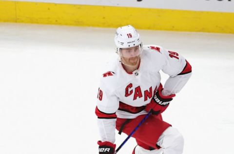 CHICAGO, ILLINOIS – MARCH 30: Dougie Hamilton #19 of the Carolina Hurricanes advances the puck against the Chicago Blackhawks at the United Center on March 30, 2021, in Chicago, Illinois. The Blackhawks defeated the Hurricanes 2-1. (Photo by Jonathan Daniel/Getty Images)